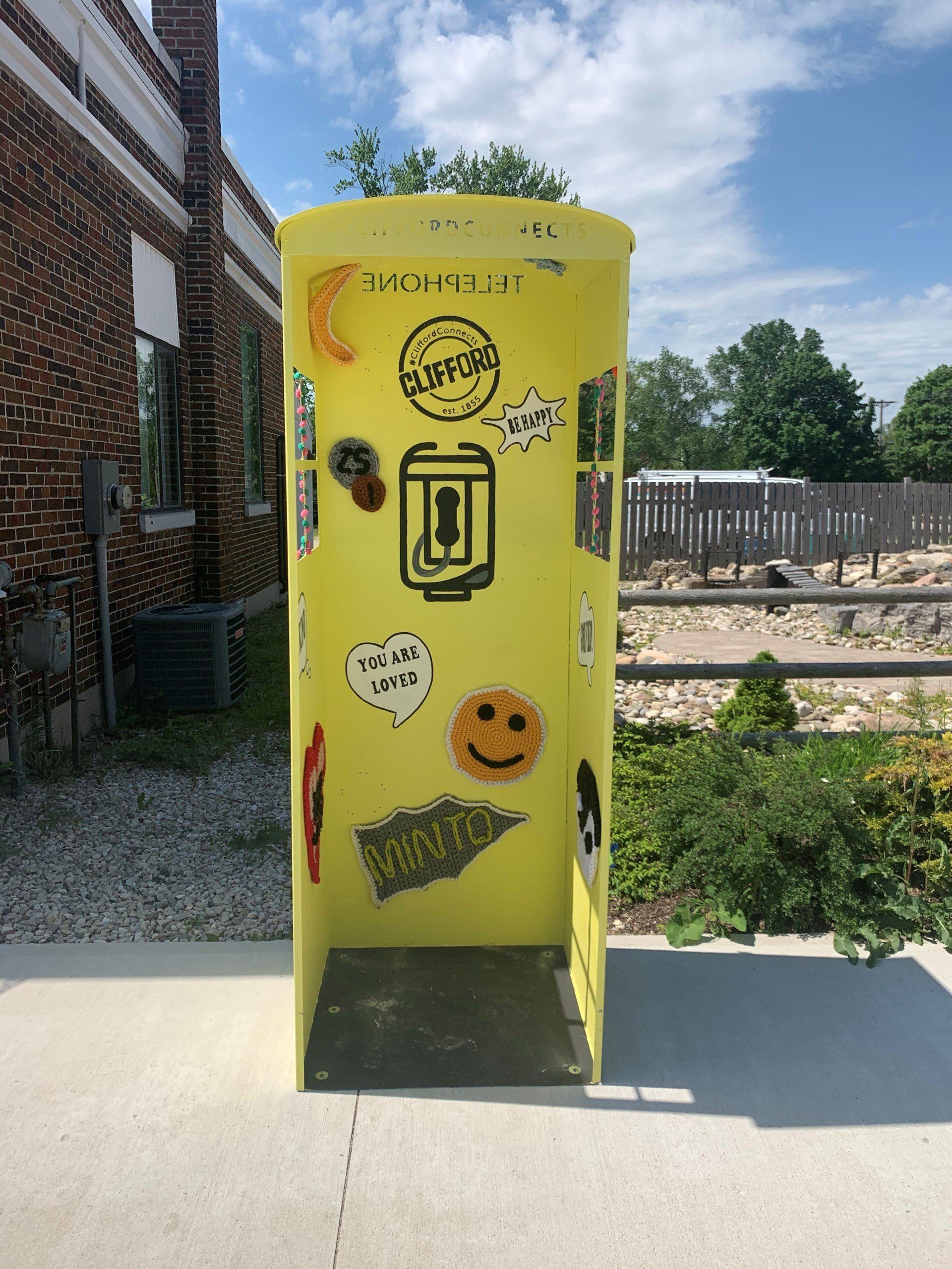 This booth was made for talking” mural – interactive art installation - yellow booth front