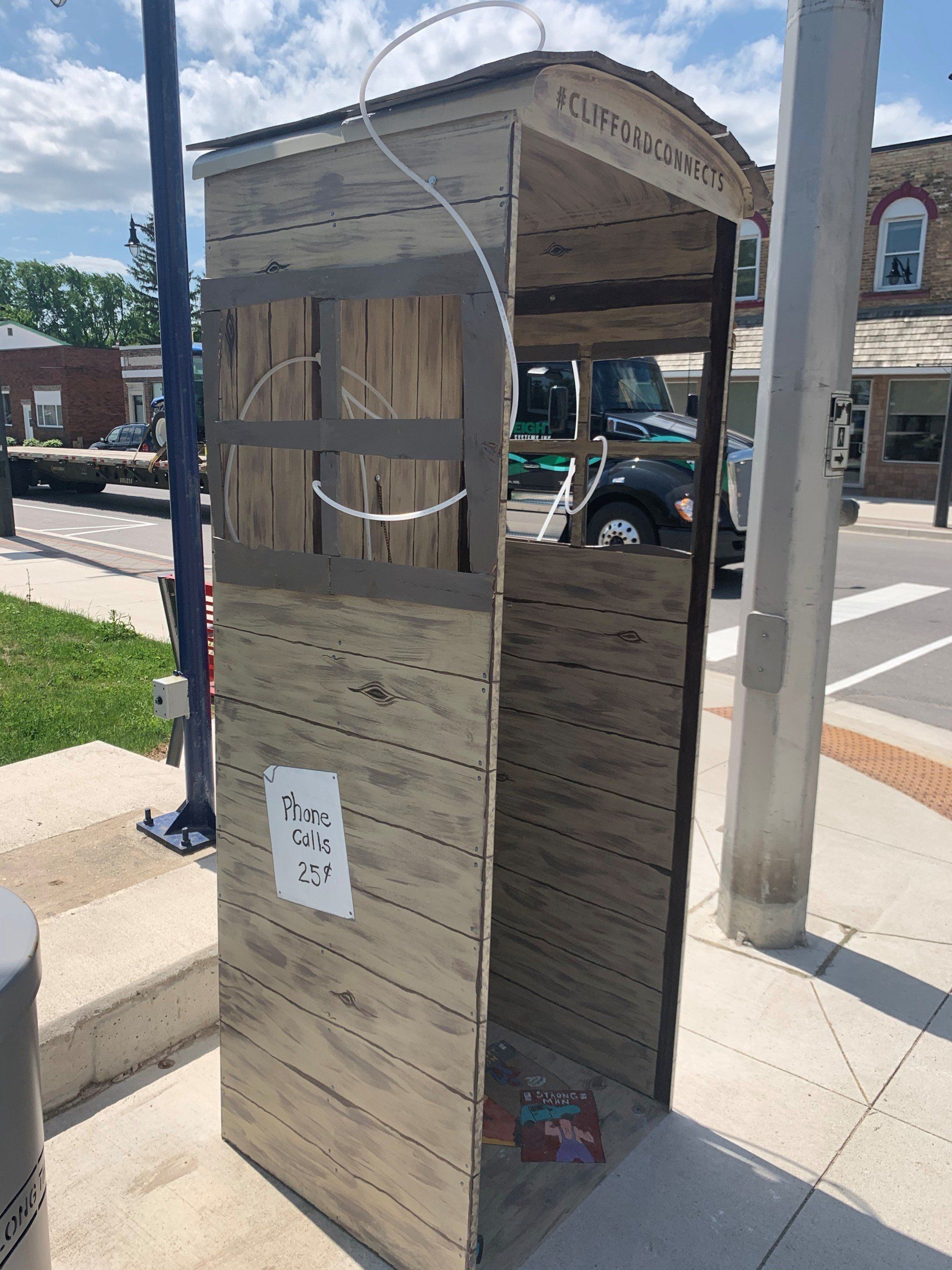 This booth was made for talking” mural – interactive art installation - wooden booth side