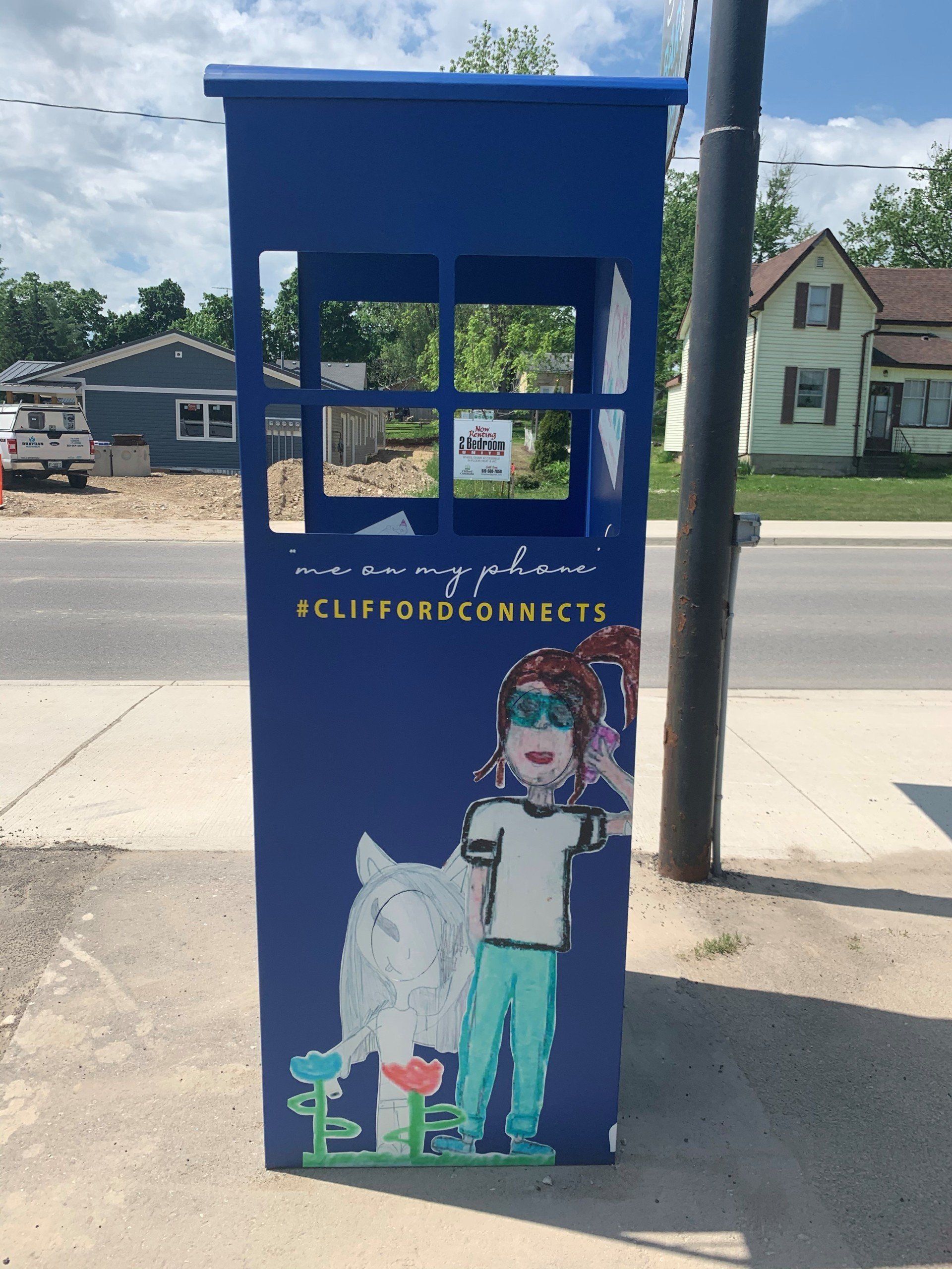 This booth was made for talking” mural – interactive art installation - blue booth side