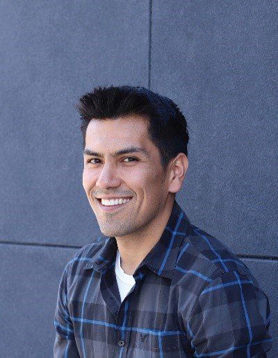 A man with a perfect smile through advanced orthodontics.