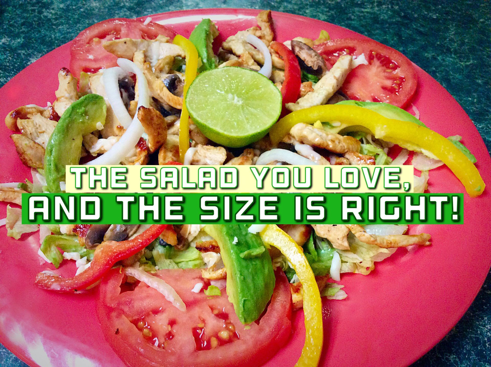 Salad on red plate with avocado, tomato, peppers, lime, and text: “The salad you love, and the size is right!”