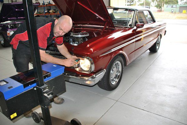 brad working on classic car
