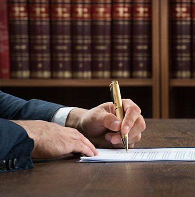 Debt Forgiveness — Hand Signing In Law Document in Whitehall, PA Debt Forgiveness — Hand Signing In Law Document in Whitehall, PA