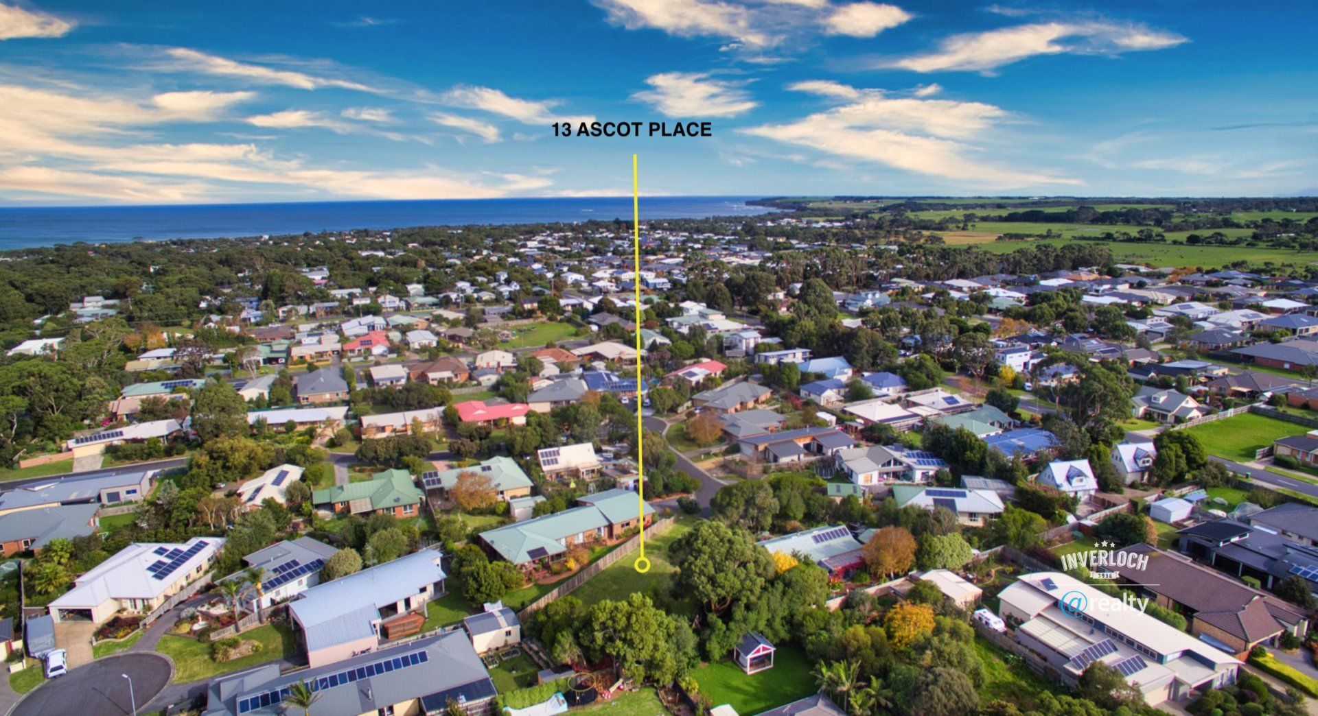 An aerial view of a residential area with lots of houses and trees.