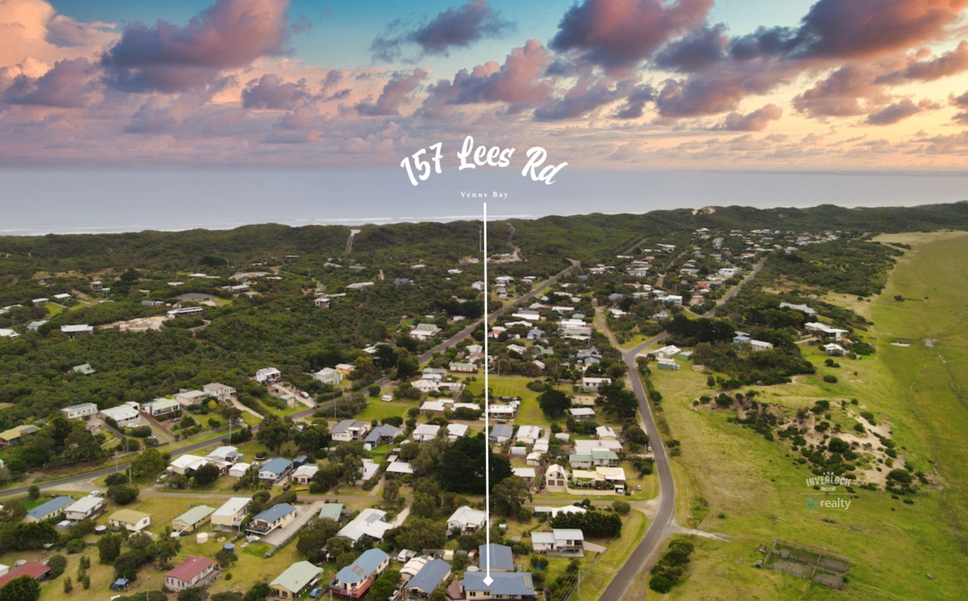 An aerial view of a residential area with houses and trees