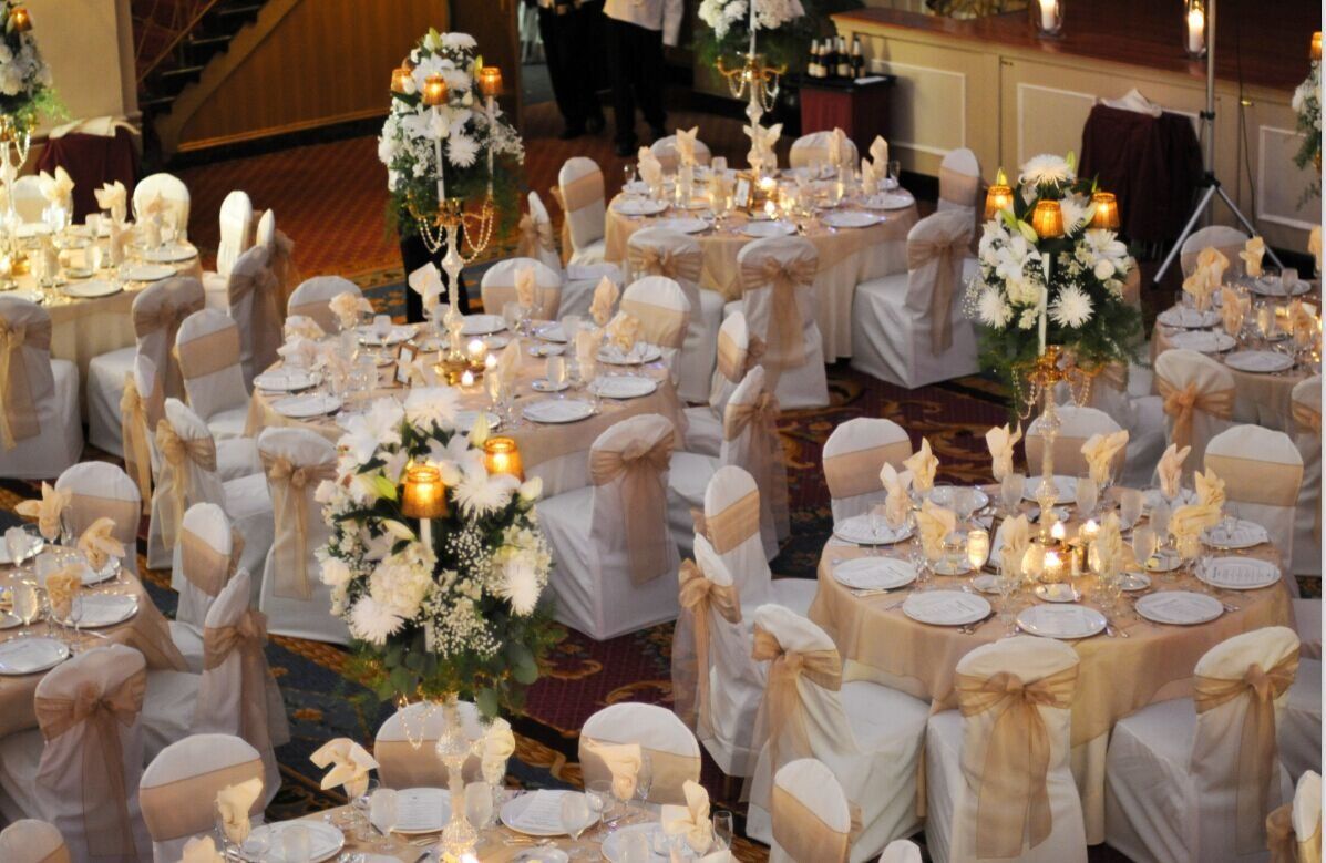 a large room with tables and chairs set up for a wedding reception