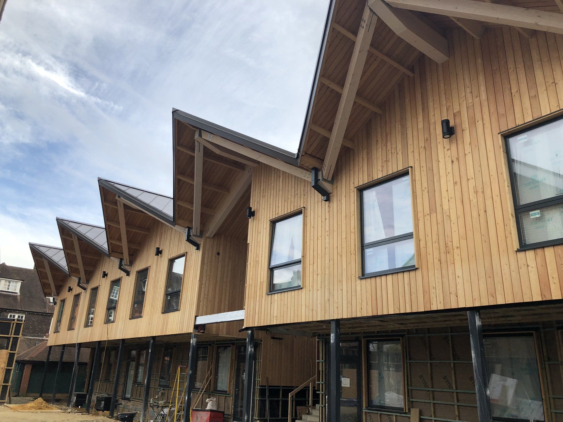 Cedar cladding, school classrooms, Cranleigh, Surrey. Builder. Building contractor. Construction. Carpentry. Carpentry contractor. Extensions. New builds. Timber frame fabrication and erection. Design and build. Kitchen installations. Horsham. Surrey. Reigate. Redhill. Dorking. Crawley. West Sussex. Cranleigh.