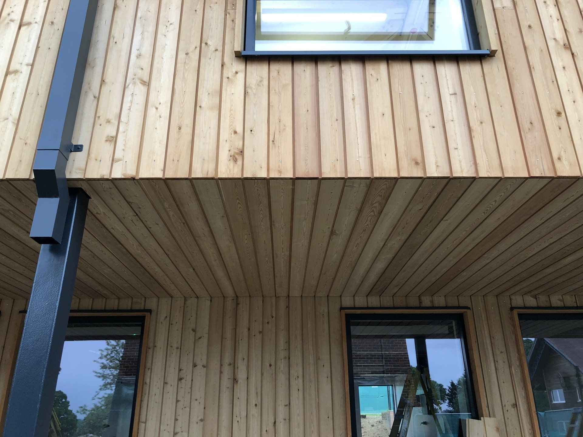 Cedar cladding, school classrooms, Cranleigh, Surrey. Builder. Building contractor. Construction. Carpentry. Carpentry contractor. Extensions. New builds. Timber frame fabrication and erection. Design and build. Kitchen installations. Horsham. Surrey. Reigate. Redhill. Dorking. Crawley. West Sussex. Cranleigh.