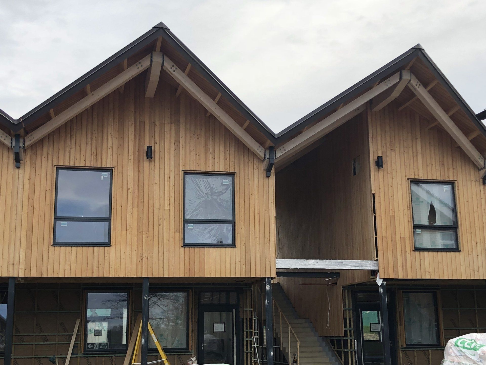 Cedar cladding, school classrooms, Cranleigh, Surrey. Builder. Building contractor. Construction. Carpentry. Carpentry contractor. Extensions. New builds. Timber frame fabrication and erection. Design and build. Kitchen installations. Horsham. Surrey. Reigate. Redhill. Dorking. Crawley. West Sussex. Cranleigh.