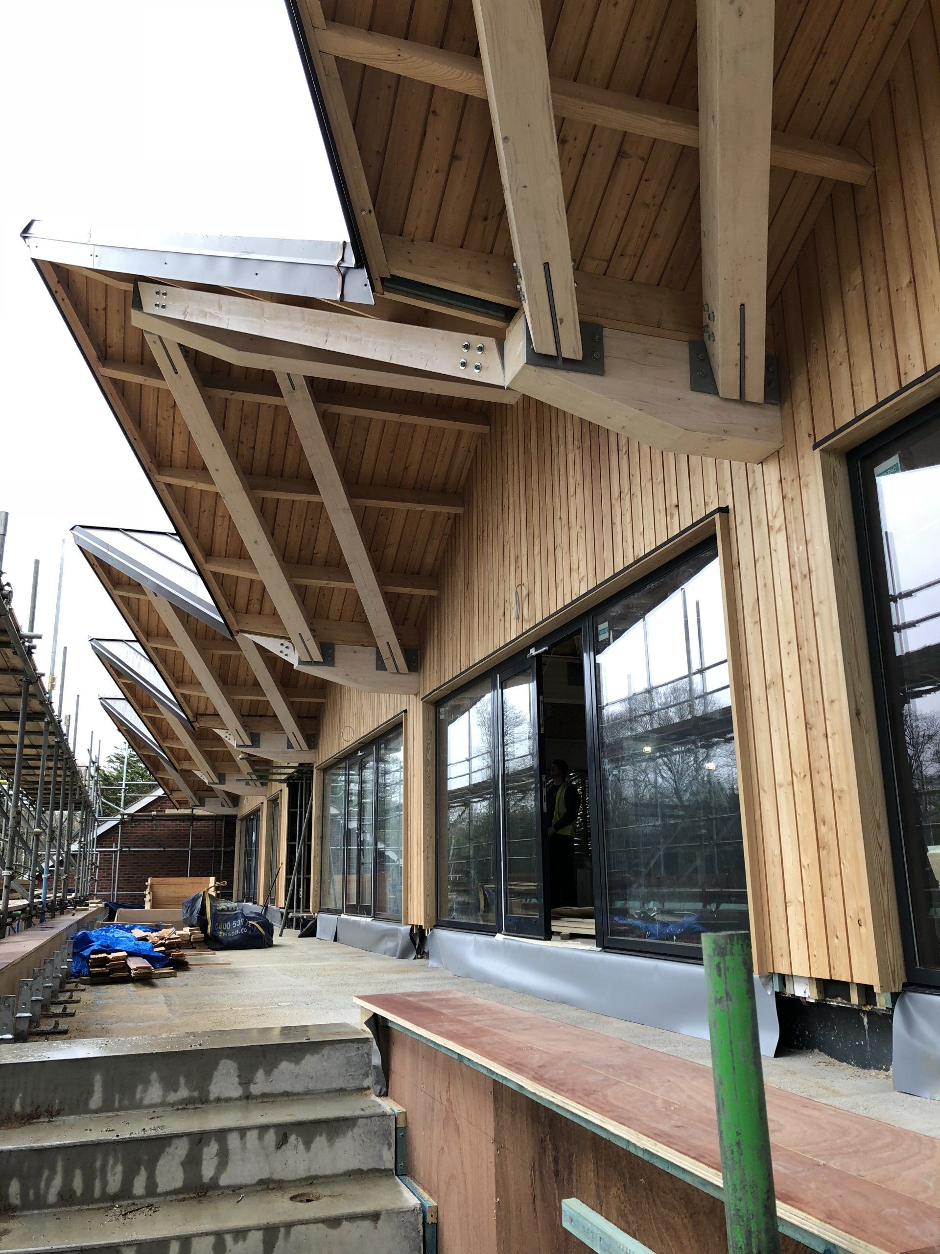 Cedar cladding, school classrooms, Cranleigh, Surrey. Builder. Building contractor. Construction. Carpentry. Carpentry contractor. Extensions. New builds. Timber frame fabrication and erection. Design and build. Kitchen installations. Horsham. Surrey. Reigate. Redhill. Dorking. Crawley. West Sussex. Cranleigh.