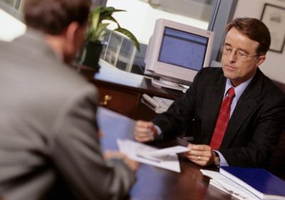 Insurance Advisor Talking With Customer In Office — Public Insurance Adjusters in South Easton, MA Insurance Advisor Talking With Customer In Office — Public Insurance Adjusters in South Easton, MA
