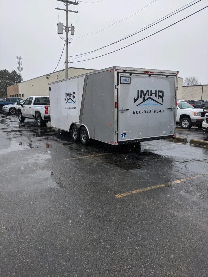 A silver enclosed trailer with 