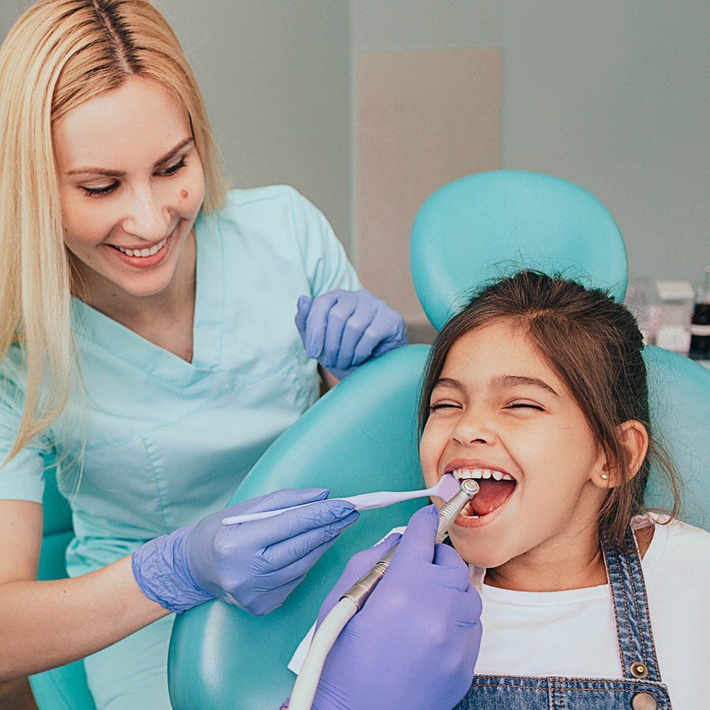 Happy Little Girl with the Dentist — Hickory, NC — McDonald Family Dentistry