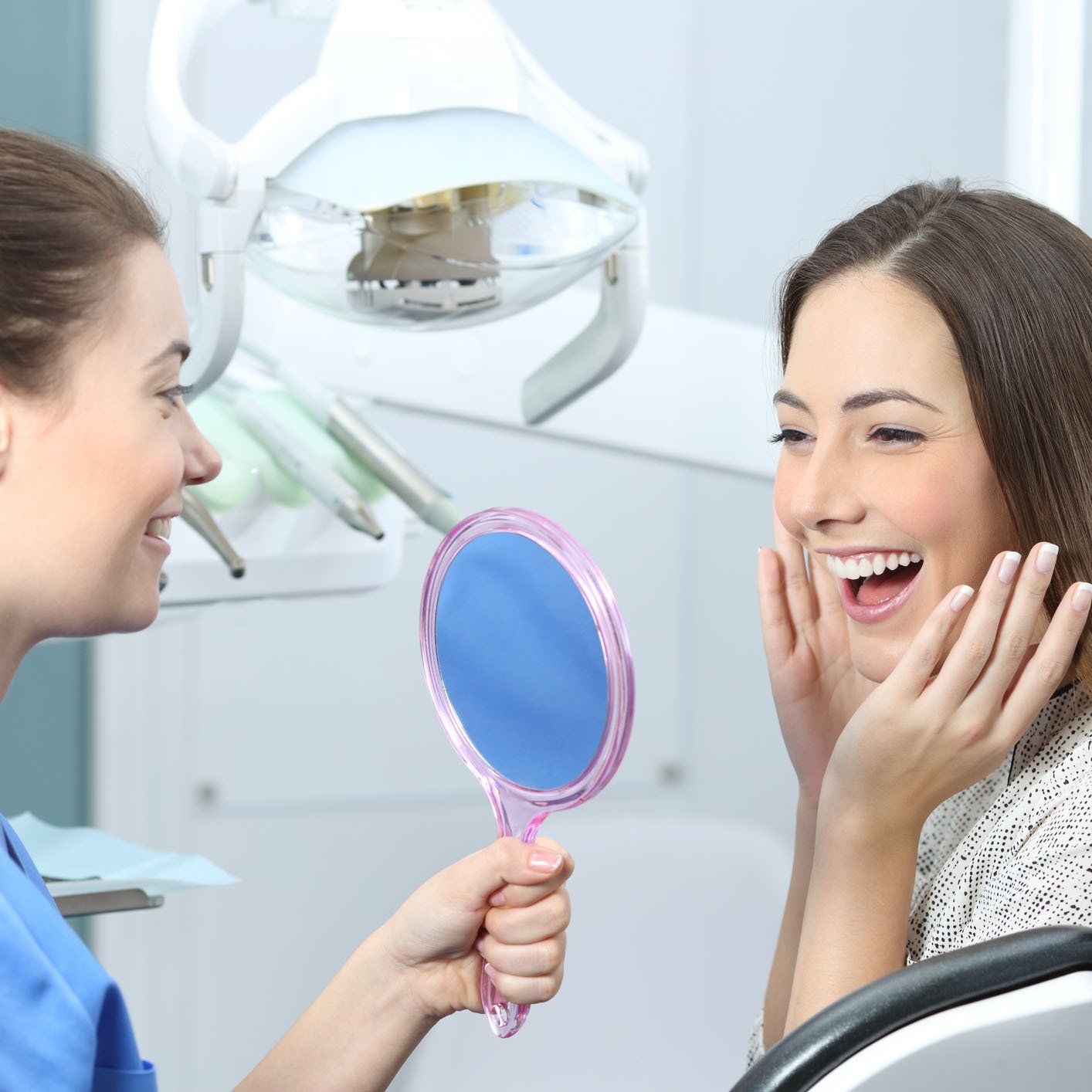 Happy Woman Looking at the Mirror — Hickory, NC — McDonald Family Dentistry Happy Woman Looking at the Mirror — Hickory, NC — McDonald Family Dentistry