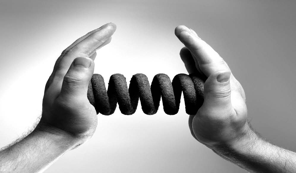 hands holding a spring in between them