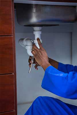 Plumber fixing water line — plumbing solutions in Fountain Valley, CA Plumber fixing water line — plumbing solutions in Fountain Valley, CA