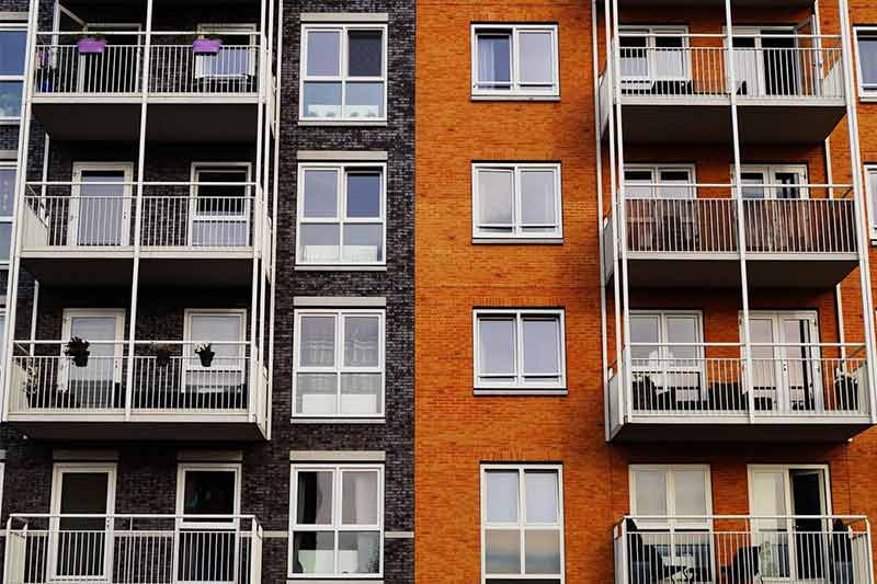 Black And Orange Apartment Building — Livonia, MI — Charles J Schneider PC Black And Orange Apartment Building — Livonia, MI — Charles J Schneider PC