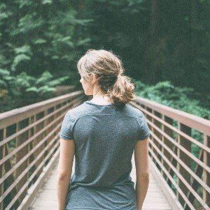 Girl on bridge. Inspiration for transition coaching.