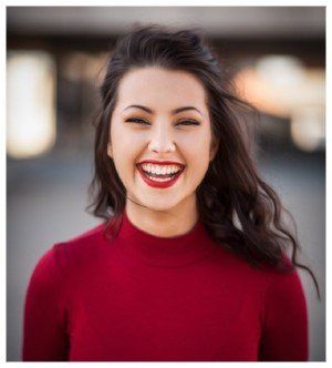 Girl in red jumper smiling: Laura Blackburn from Transition Solutions hosting this one day small group career coaching workshop.