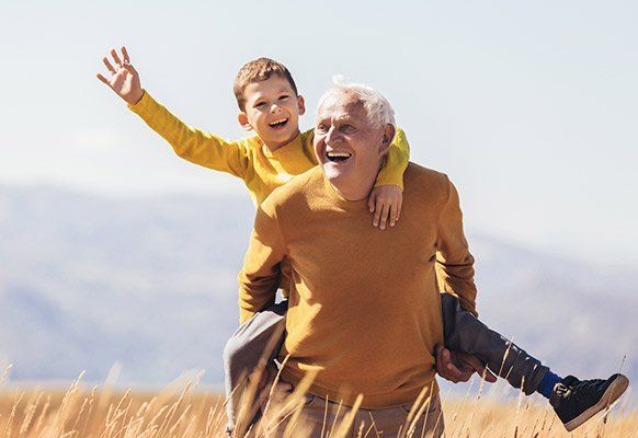 Grandson Piggyback with his Grandfather — Benton County Health Department — Warsaw, MO