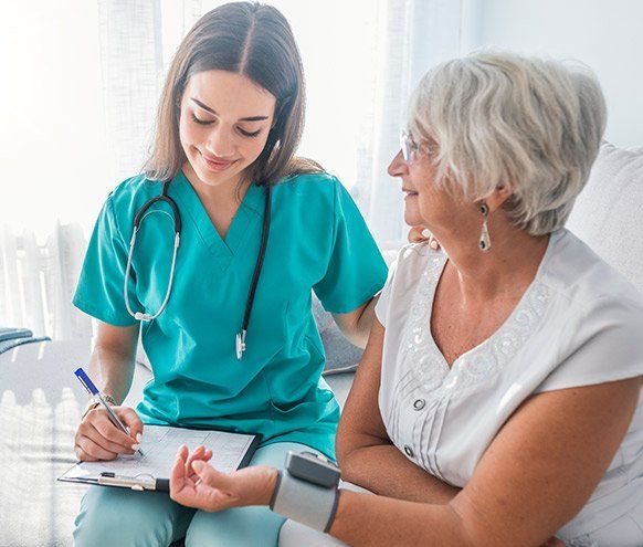 Older Person having Blood Pressure Checked — Benton County Health Department — Warsaw, MO Older Person having Blood Pressure Checked — Benton County Health Department — Warsaw, MO