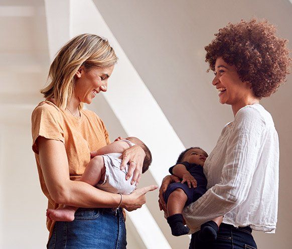 Two Mothers Holding Newborn Babies — Benton County Health Department — Warsaw, MO Two Mothers Holding Newborn Babies — Benton County Health Department — Warsaw, MO
