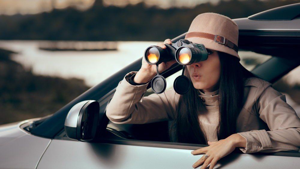 Woman with binoculars Spousal Spying Wilmington NC