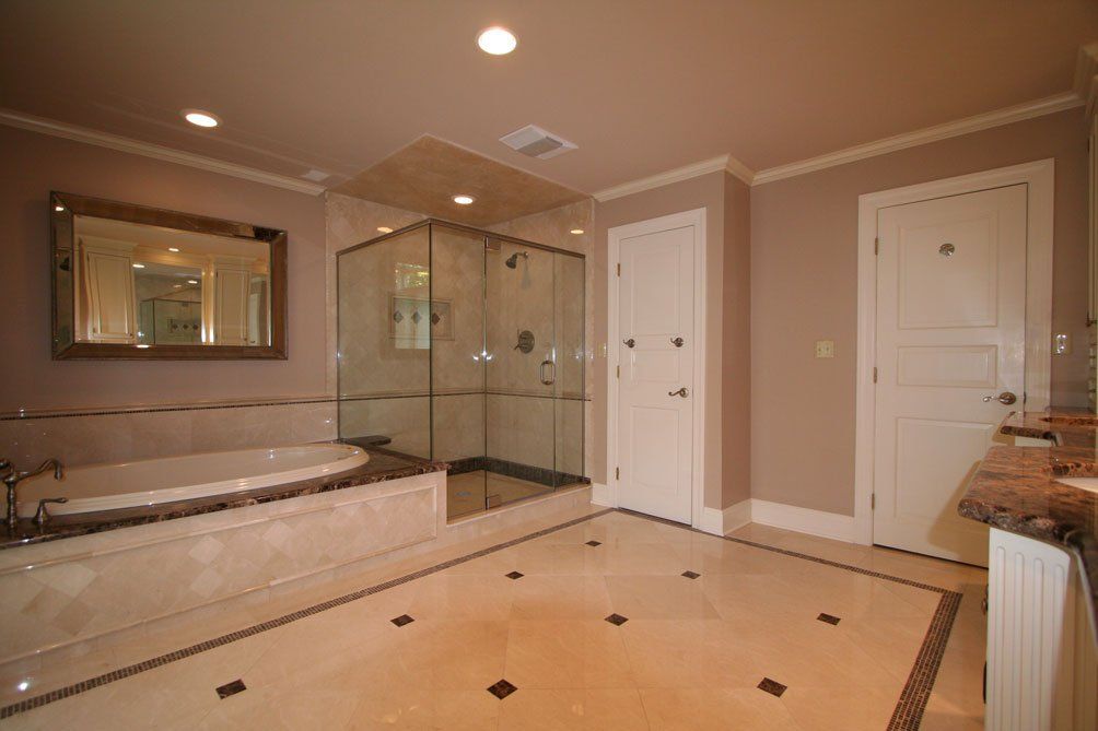 Luxury bathroom remodel with tub and glass shower