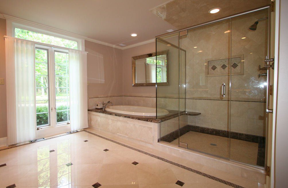 Bathroom renovation with tub surround and glass shower