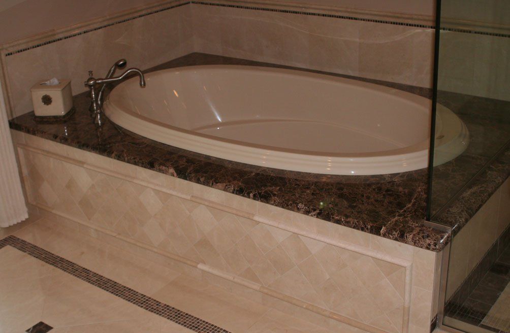 Granite bathroom tub surround countertop installation