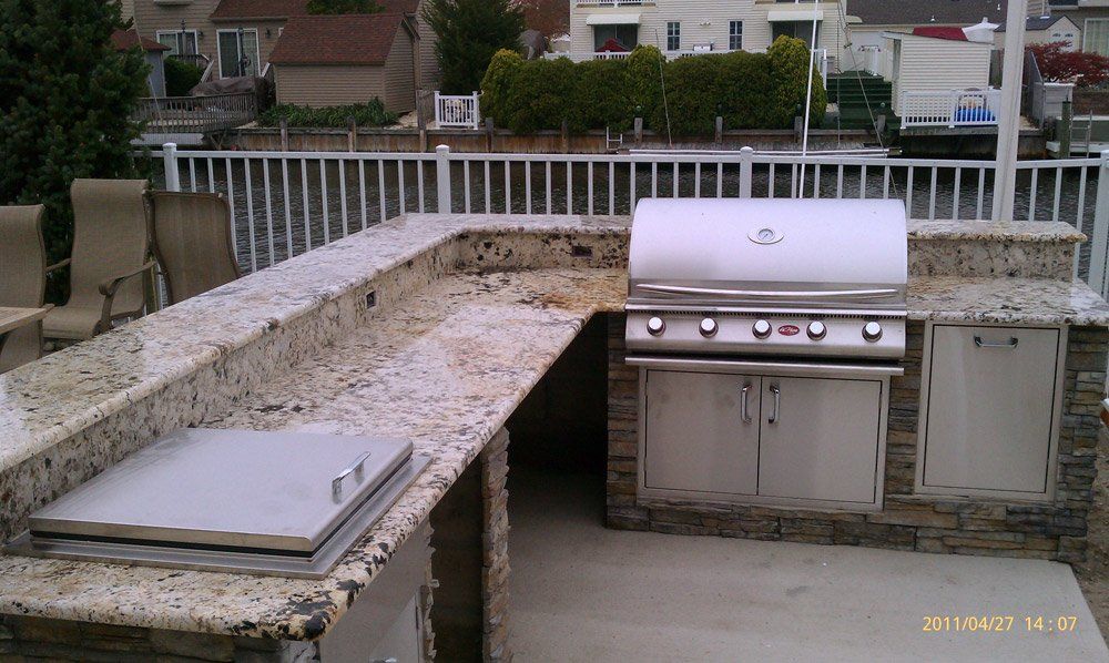 Outdoor stone BBQ countertop installation