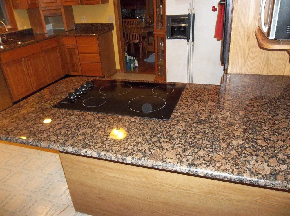 Baltic brown granite countertop with cooktop cutout