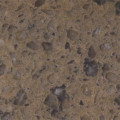 A brown quartz countertop surface with flecks and inclusions of darker brown and translucent grey stone fragments.