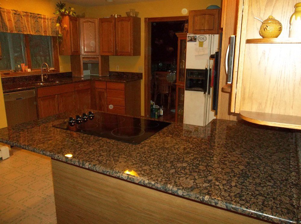 Granite kitchen island with cooktop cutout installation
