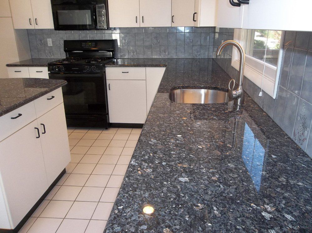 Blue granite kitchen countertop with sink peninsula