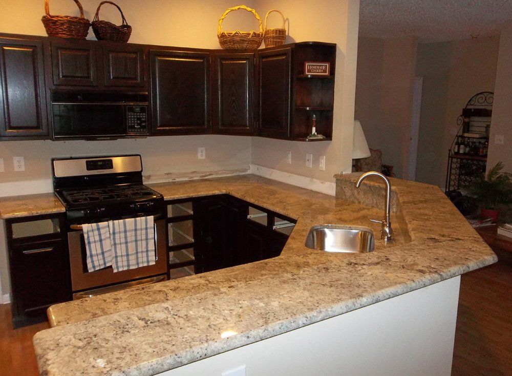 Granite kitchen countertop installation with raised breakfast bar