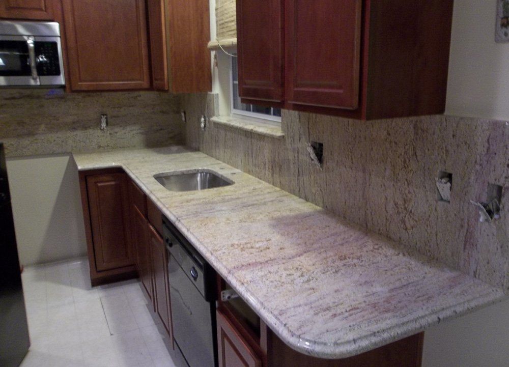 Granite kitchen countertop with backsplash installation