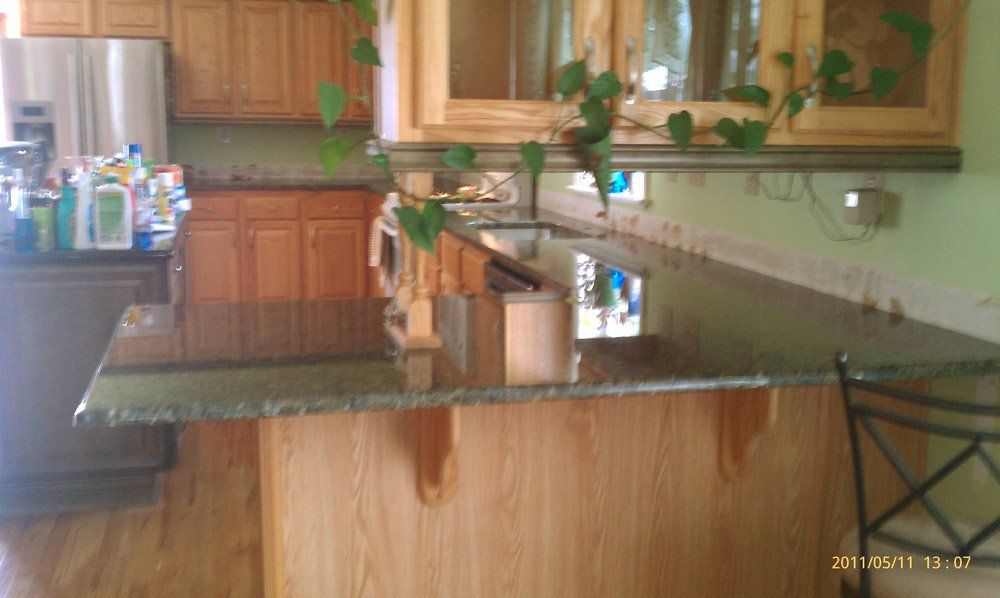Installed peacock granite kitchen island countertop