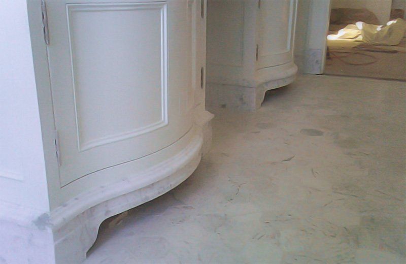 Installed marble bathroom flooring and vanity base
