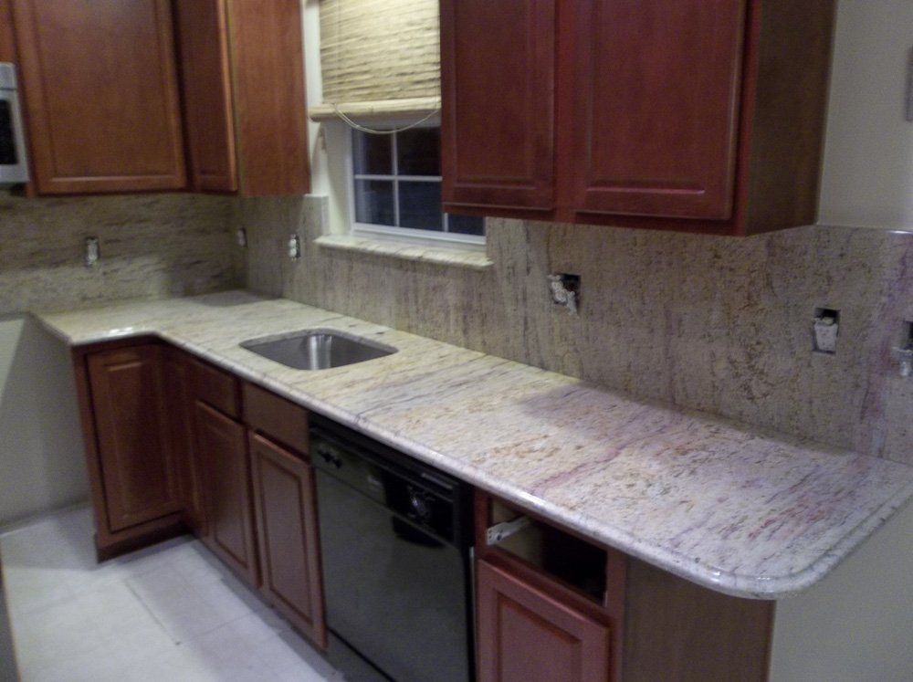 Granite kitchen countertop with undermount sink and backsplash