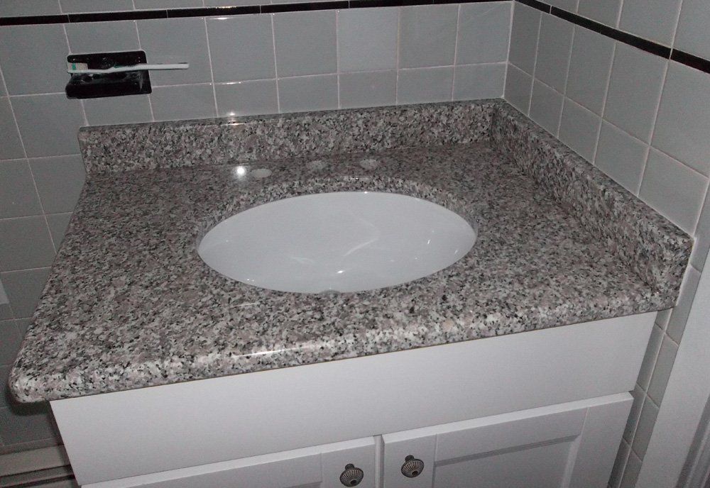 Granite bathroom vanity countertop with oval sink
