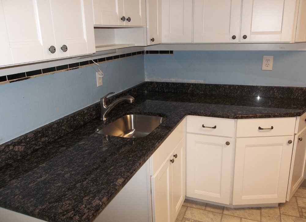 Tan brown granite countertop with undermount sink