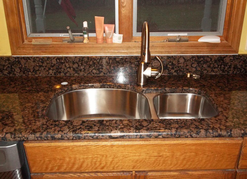 Brown granite kitchen countertop installation with sink