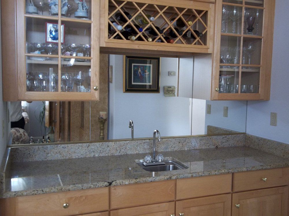 Installed wet bar granite countertop with sink and cabinets