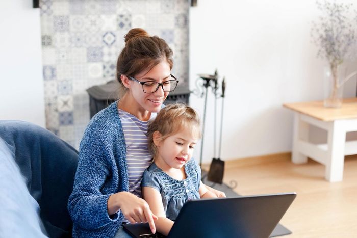 Mother and Child with Laptop — Pensacola, FL — Mary Ann Patti LLC Mother and Child with Laptop — Pensacola, FL — Mary Ann Patti LLC