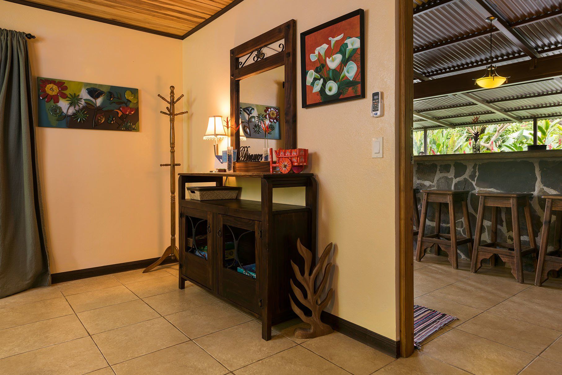 entry way with sideboard and coat hanger