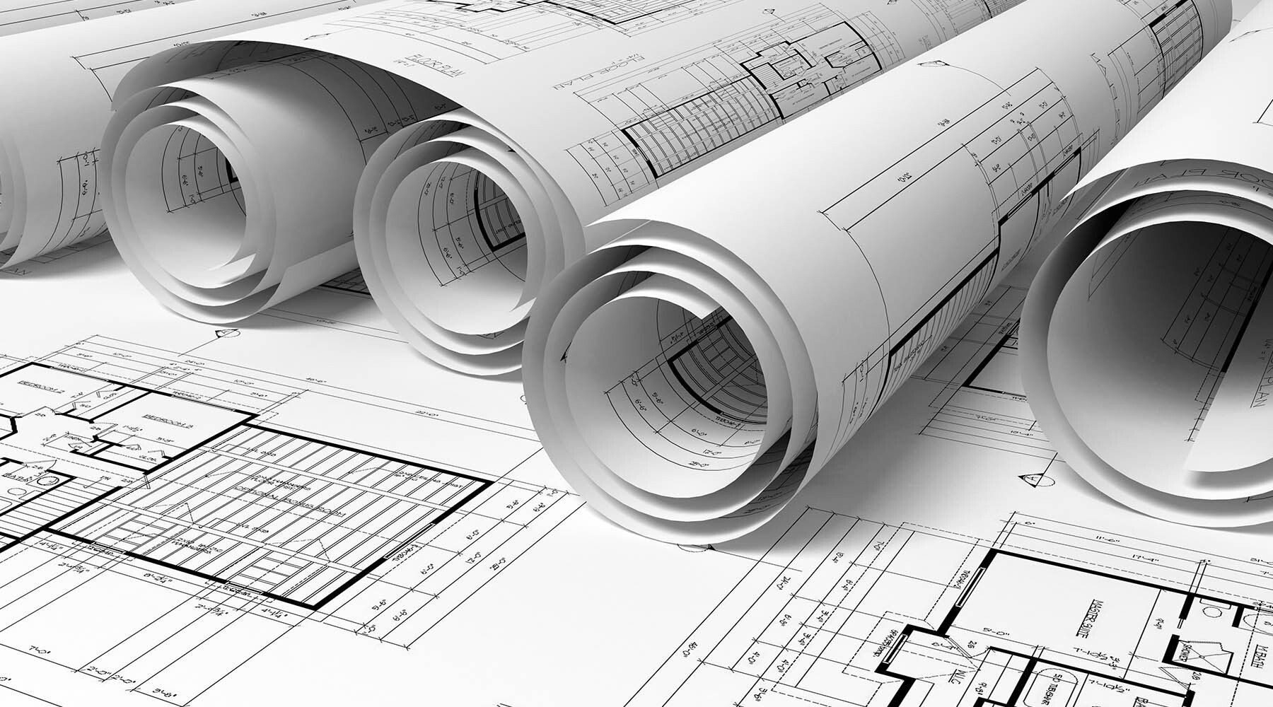 Rolled architectural blueprints, unrolled floor plan, white paper, black lines.