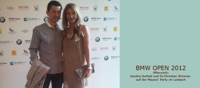 Ein Mann und eine Frau posieren für ein Foto bei den BMW Open 2012