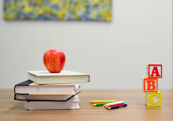 ABC blocks & books on a teacher's desk