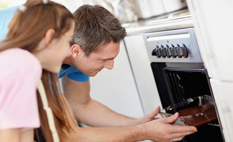 placing a baking tray in the oven